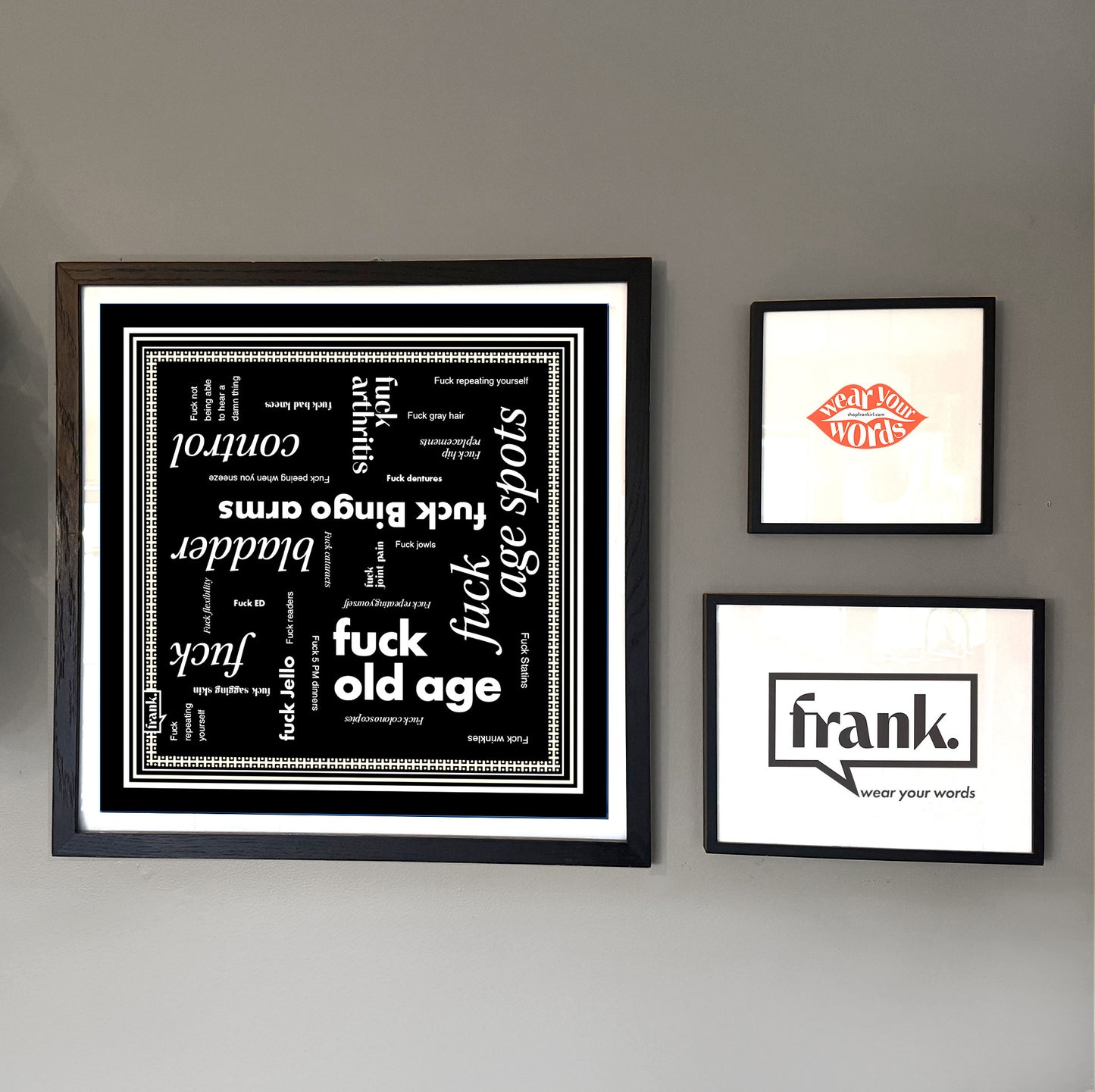 Fuck Old Age bandana framed on a wall with other prints