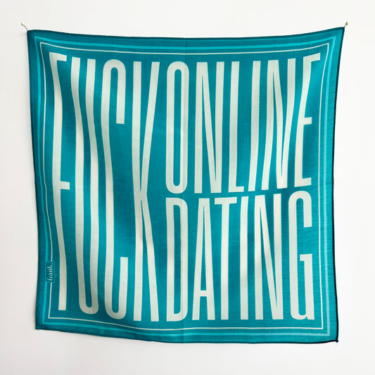 Teal scarf/handkerchief with white text on a white background. Text reads: Fuck online dating.