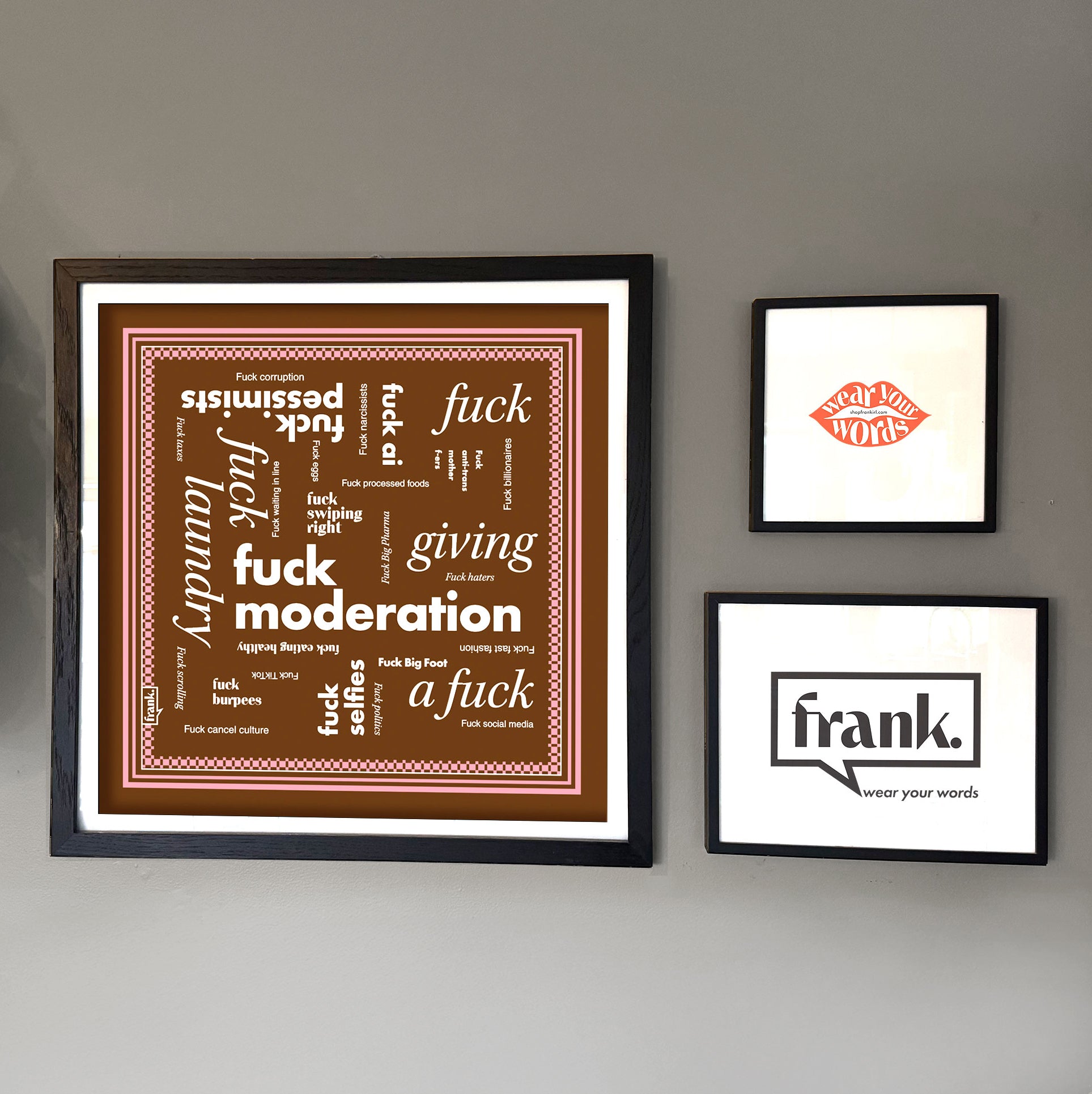 Framed Fuck Moderation bandana on a wall with other prints