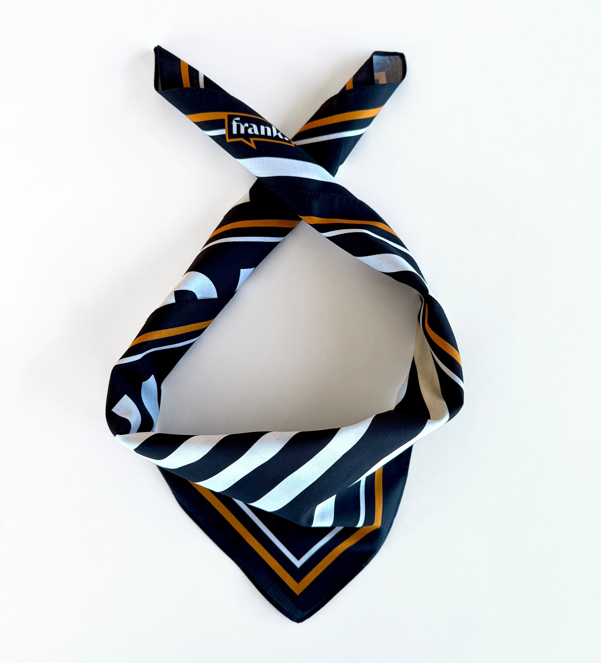 Black and white striped bandana with gold accents on a white background