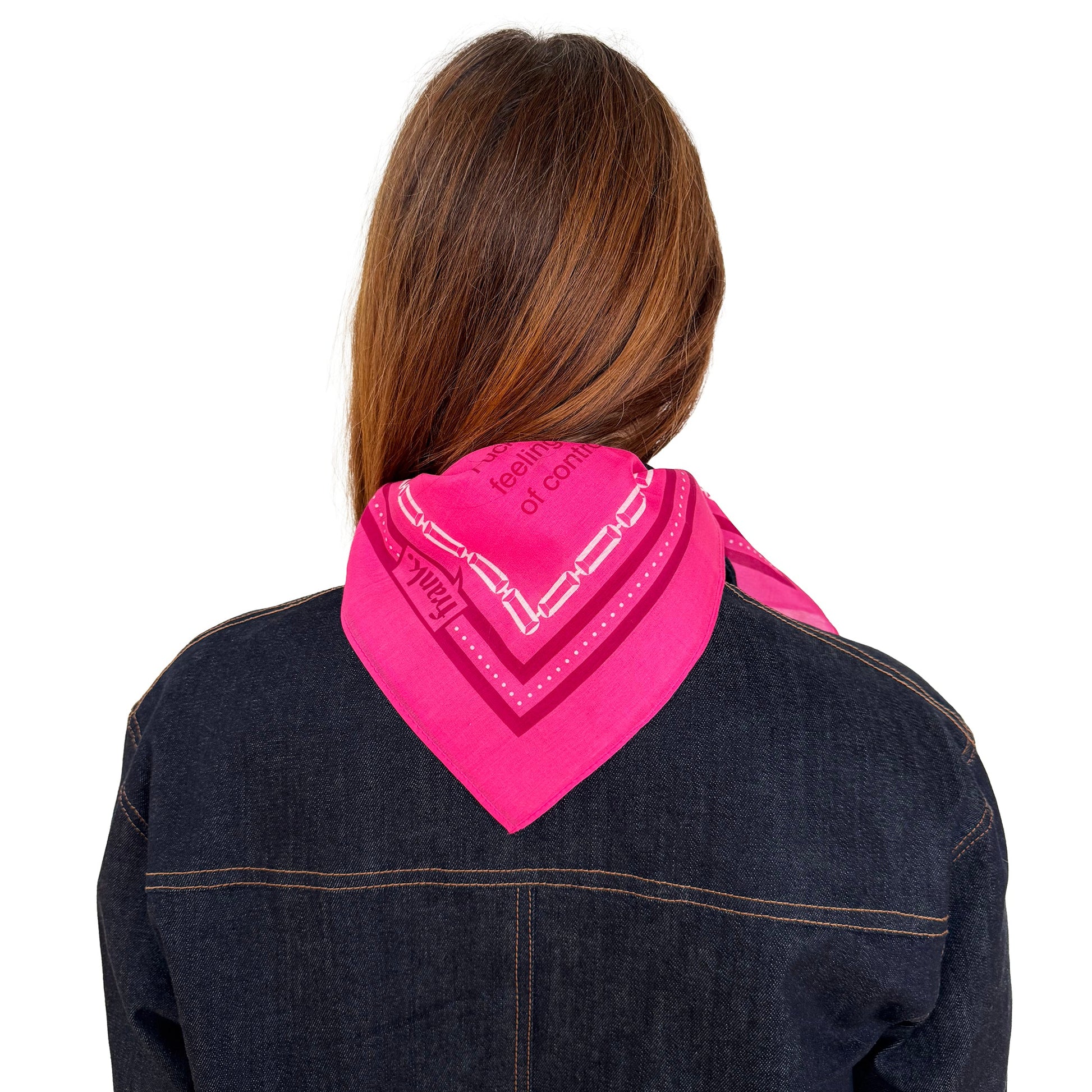 Back view of person wearing a hot pink bandana around their neck with a white background