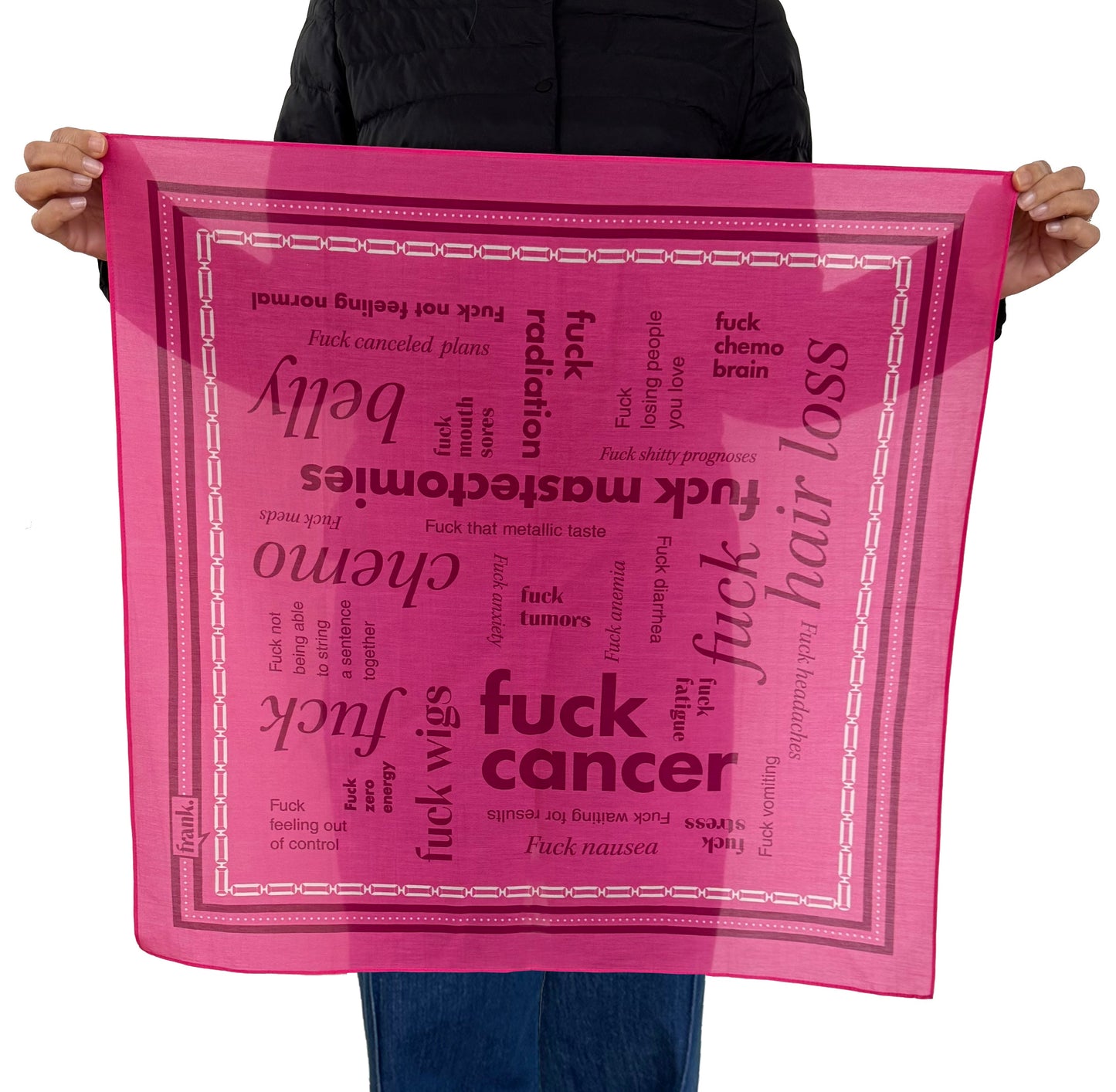 Person holding a hot pink scarf with burgundy text around the subject of Cancer, including 'Fuck Cancer' on a white background