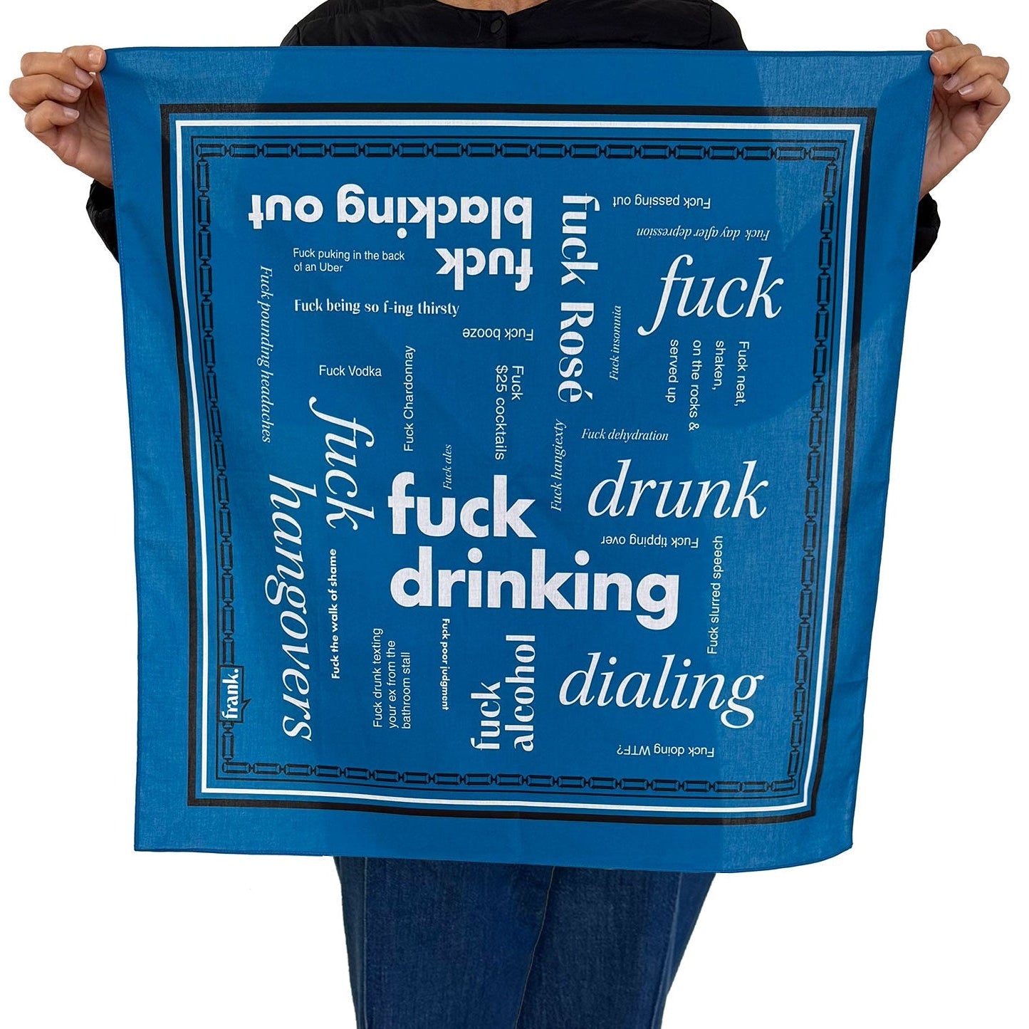 Person holding a dark blue bandana with white text around the theme of drinking, including 'Fuck Drinking'.