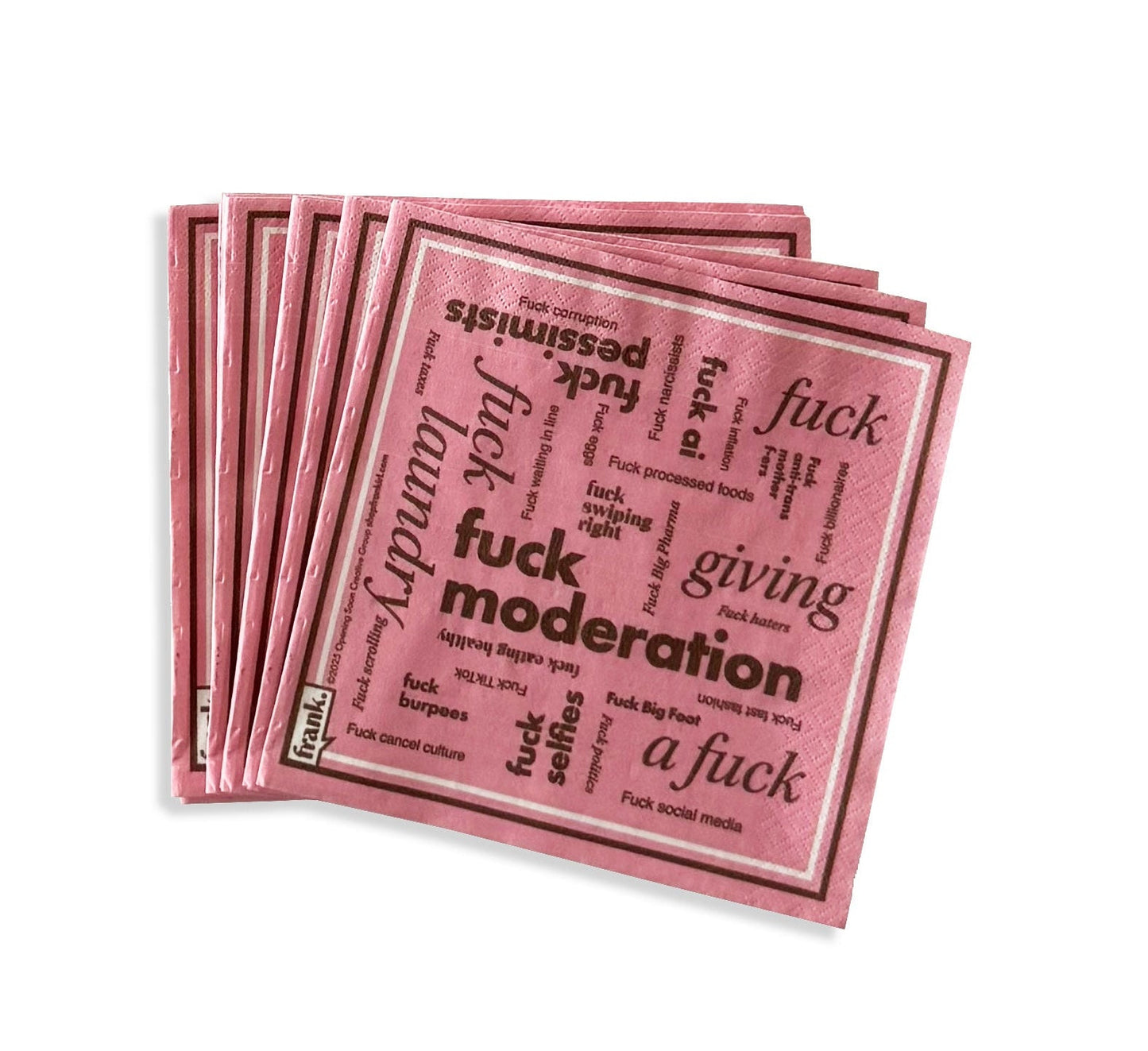 Pink napkins with words around various themes, including 'Fuck Moderation'.