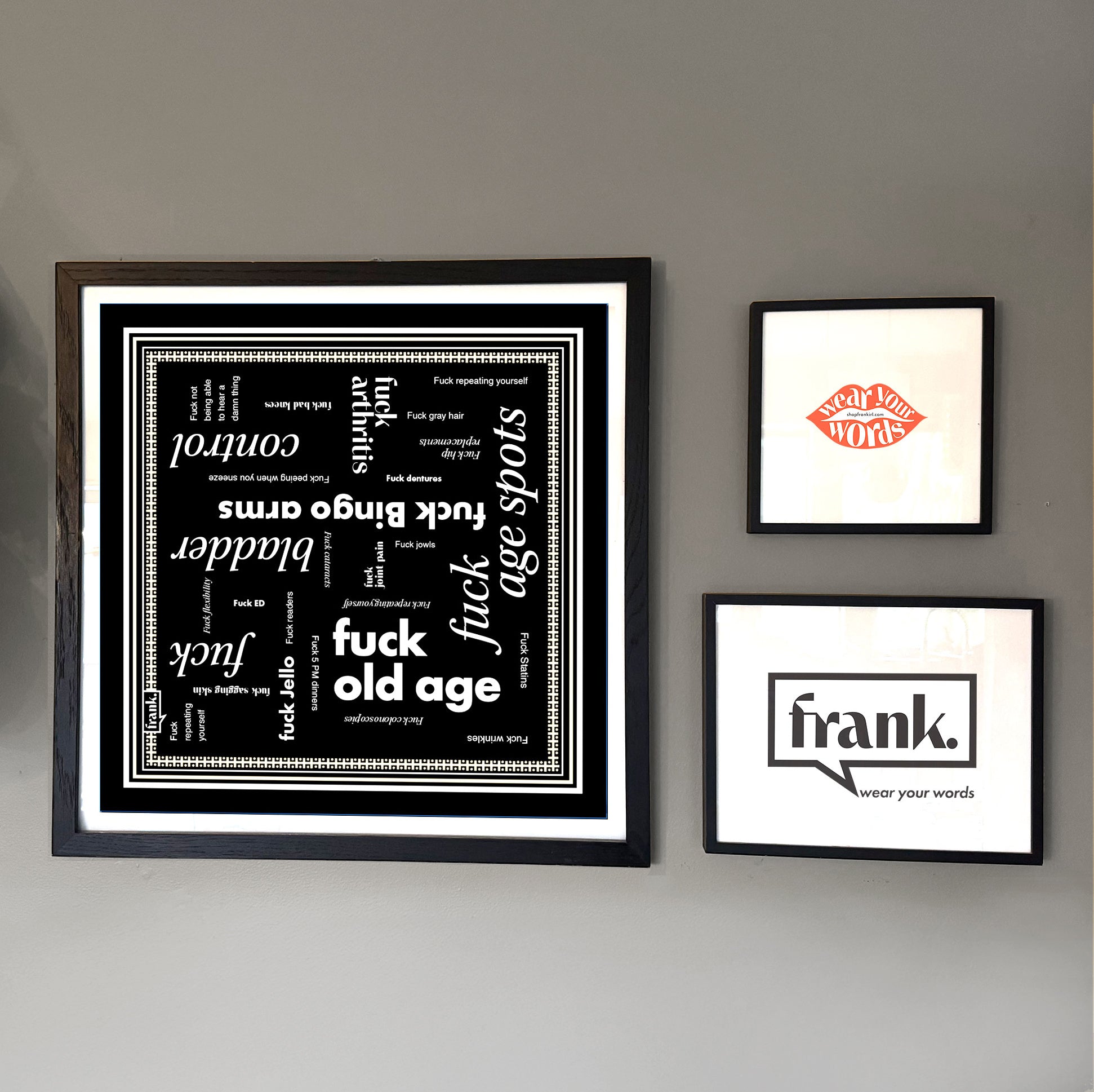 Fuck Old Age bandana framed on a wall with other prints