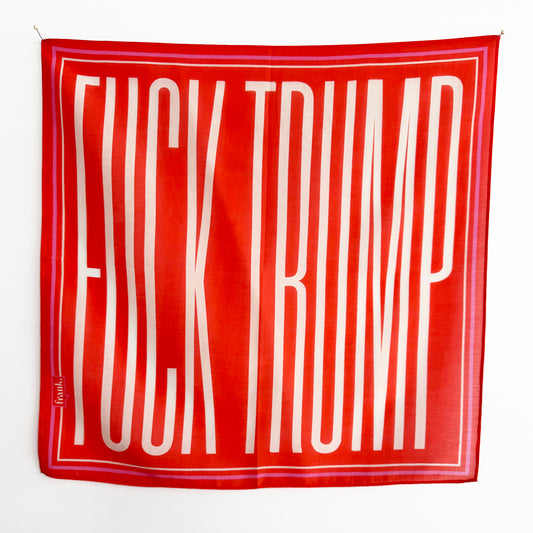 Deep orange scarf / handkerchief with 'FUCK TRUMP' printed in white on a white background. Border design brings in a pop of pink and white.
