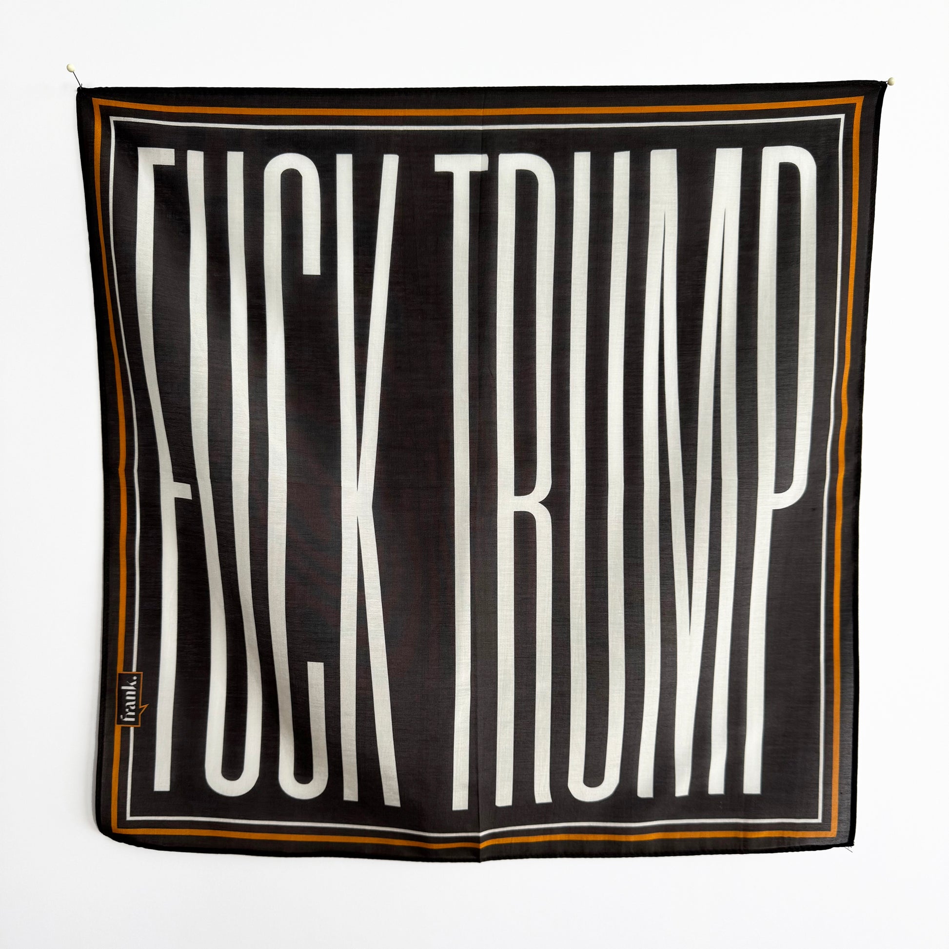 Black silk blend scarf / handkerchief with elongated 'Fuck Trump' white text on a black background