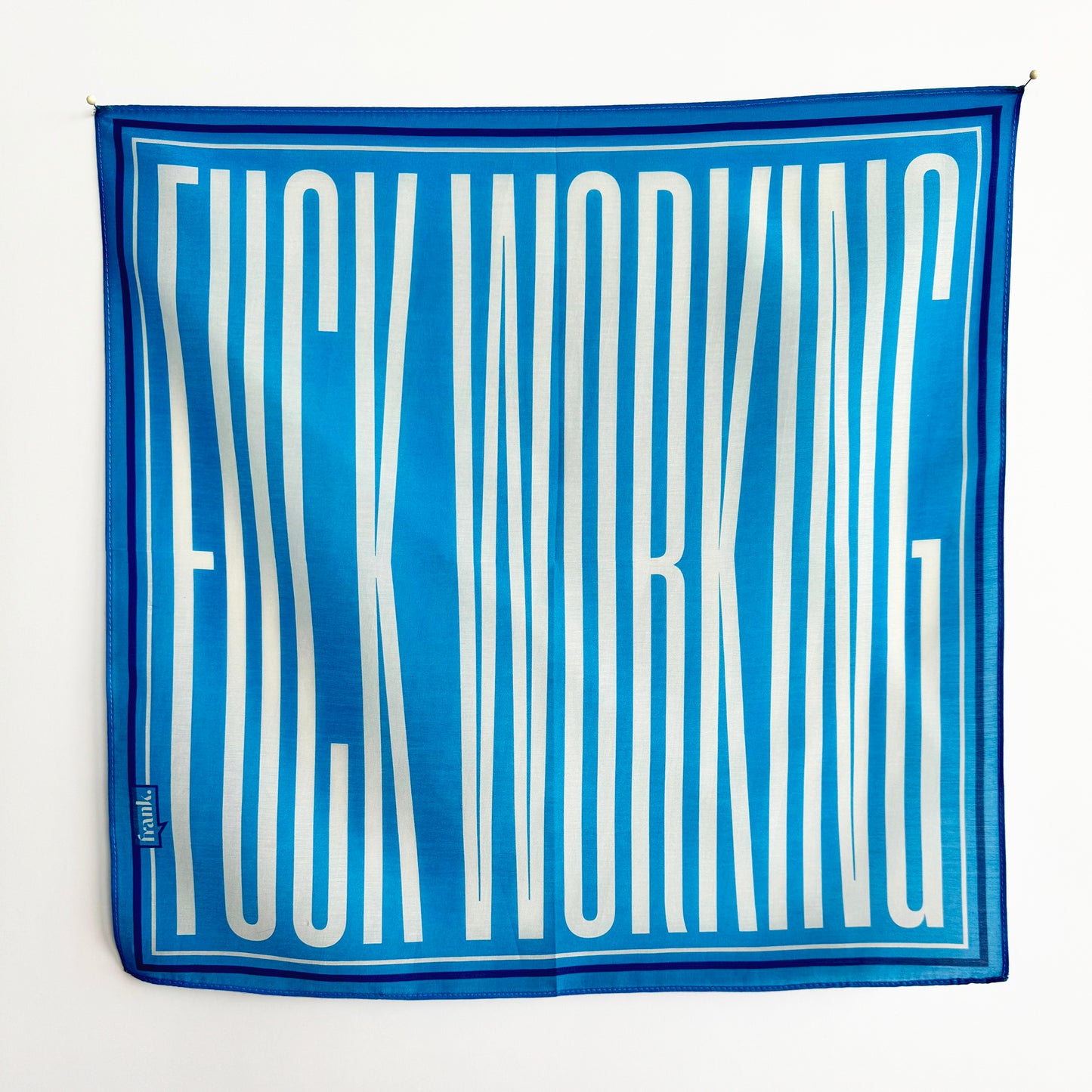 Sky blue handkerchief with white text on a white background. Typography reads: Fuck Working.