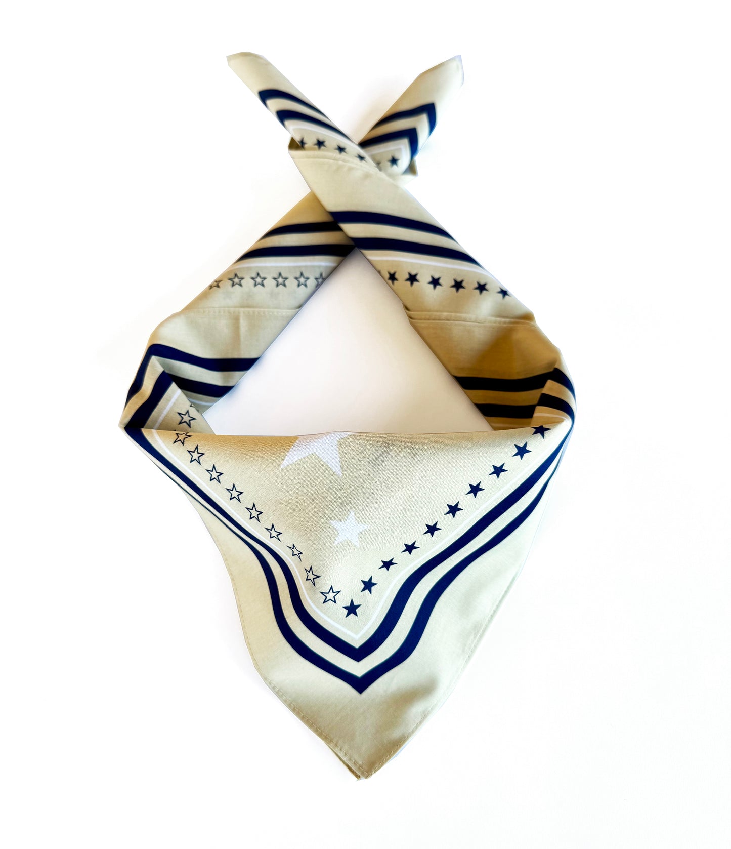Folded fabric bandana with star pattern on a white background