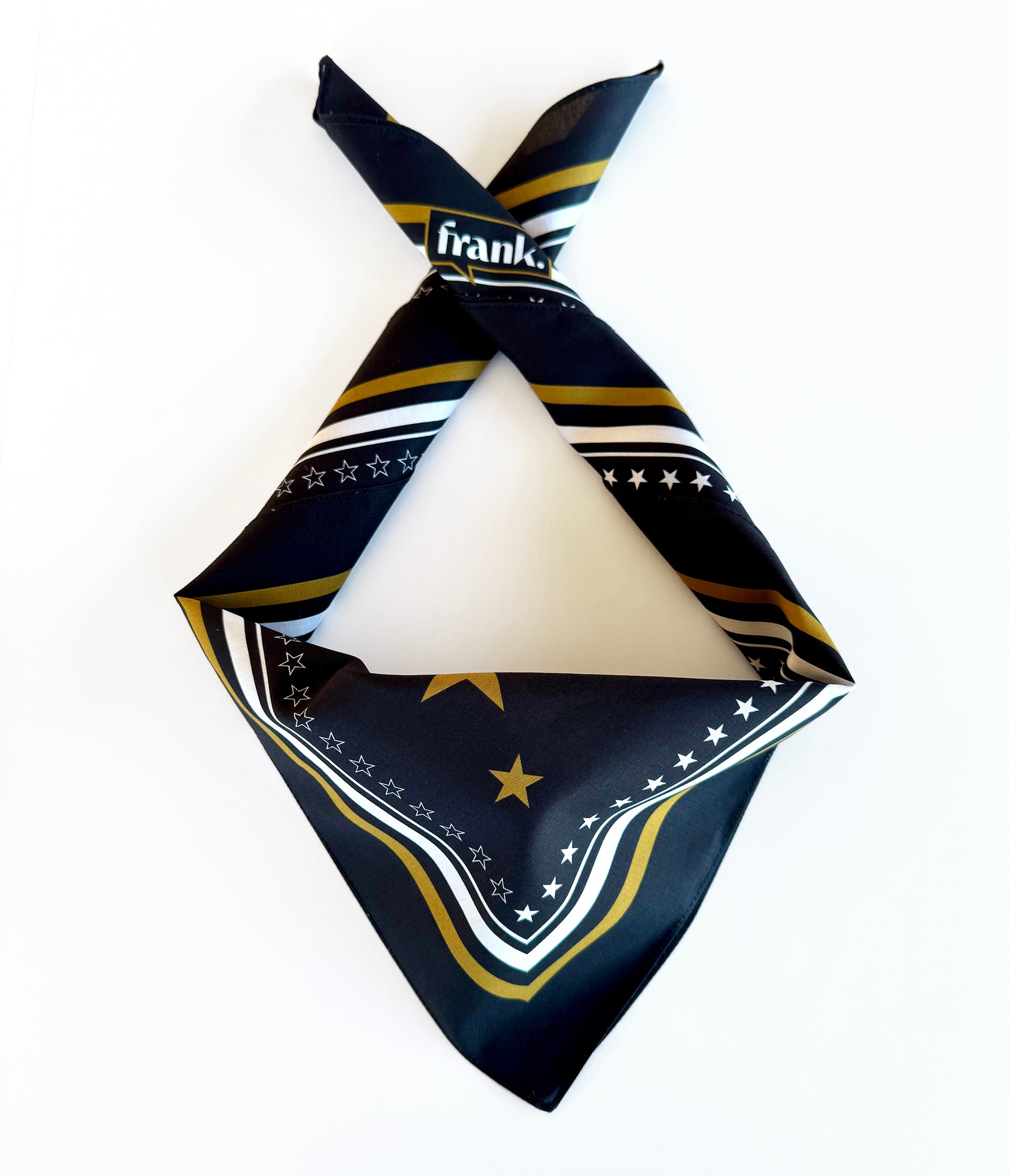 100% cotton black and gold political bandana folded with triangle of fabric in the front as could be worn. Border of gold stars and frank logo are showing. 