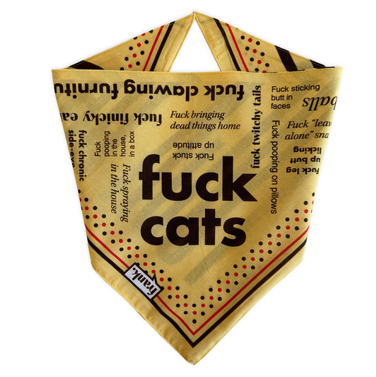 A triangular dog bandana with a black and yellow graphic print featuring the text 'fuck cats' and various related phrases, displayed on a solid white background with the brand name 'frank' in the bottom left hand corner.