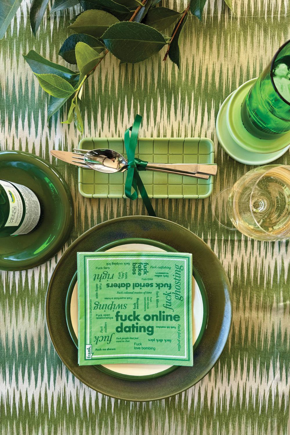 Beautiful green table setting with Fuck Online Dating green napkins on luncheon plate